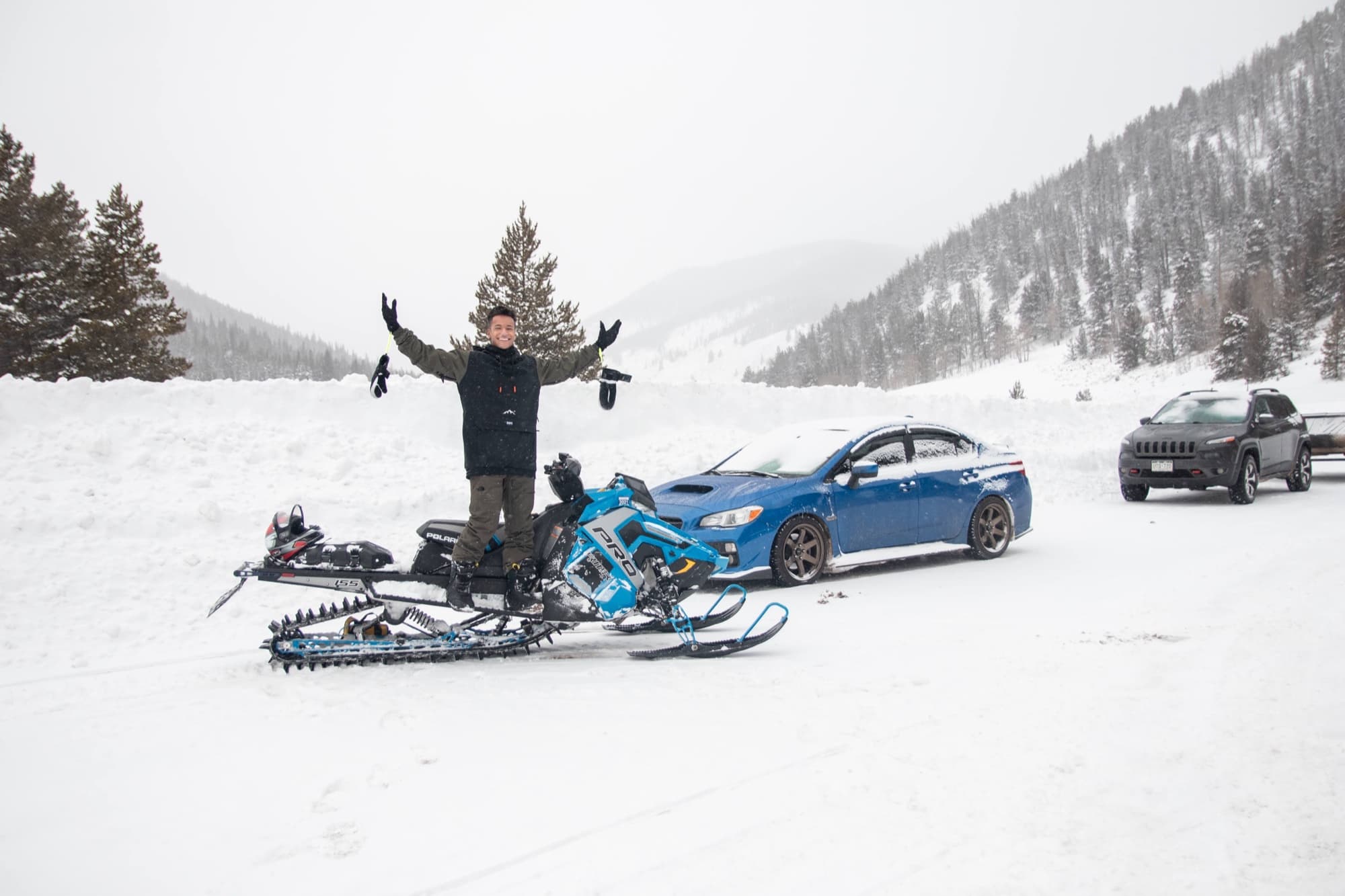 Quest with a snowmobile in the snowy mountains
